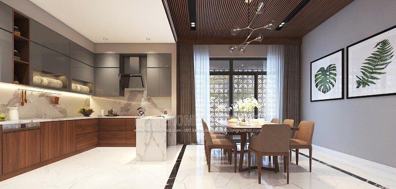 Bố trí nội thất phòng bếp liền phòng ăn sang trọng, độc đáo với nội thất gỗ chủ đạo từ tủ bếp, bộ bàn ghế, tường ốp gỗ tại biệt thự, nhà phố Vinh, Nghệ An.